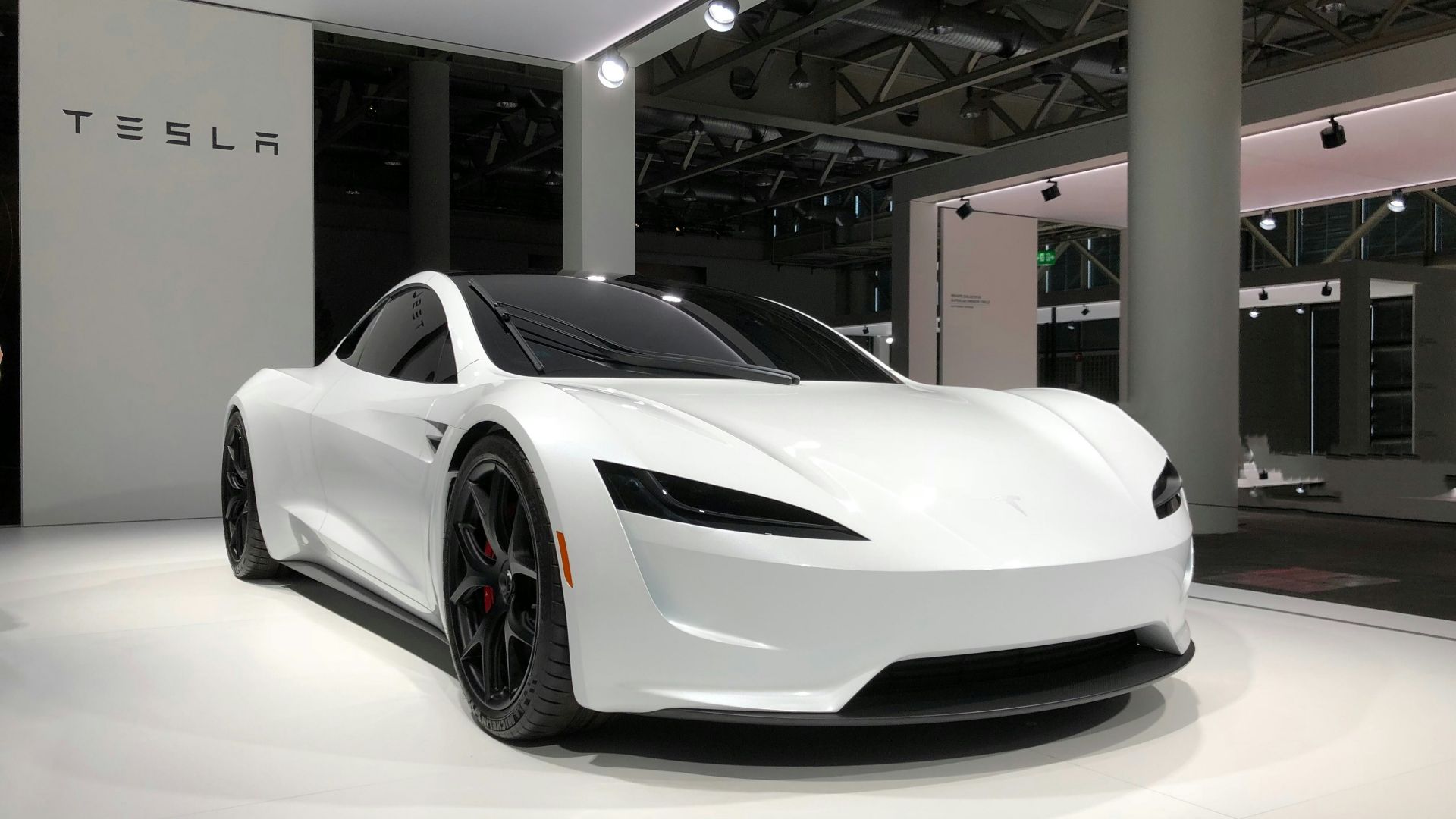 white lamborghini aventador parked in building