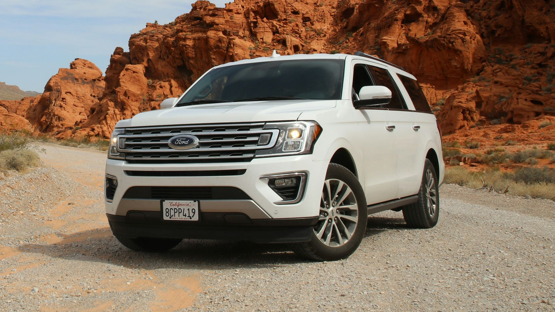 parked white Ford Explorer SUV