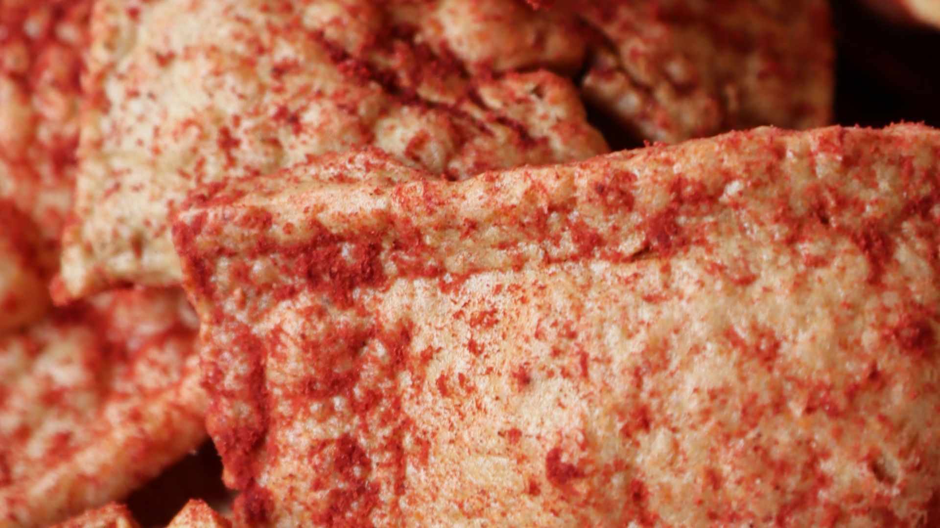 a bowl full of crackers sitting on a table