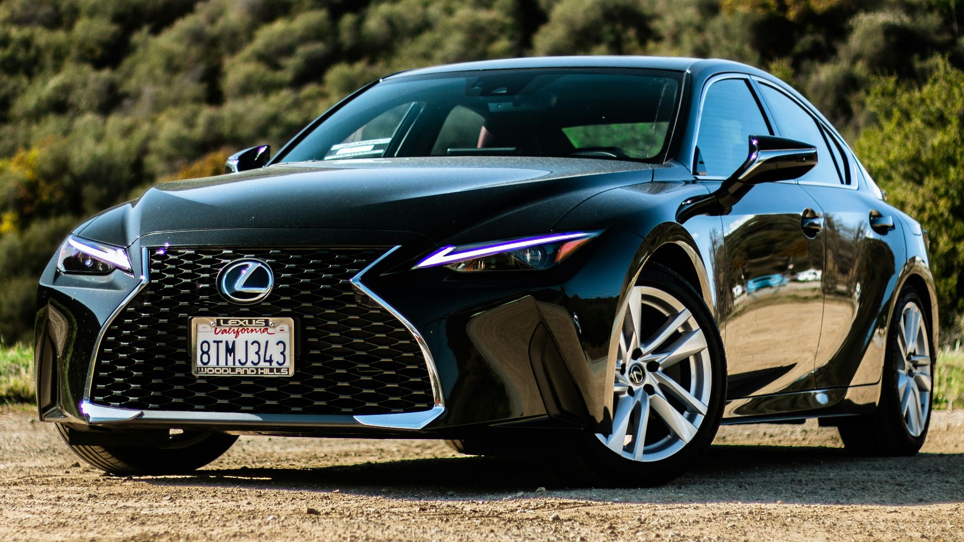 black porsche 911 on brown field during daytime