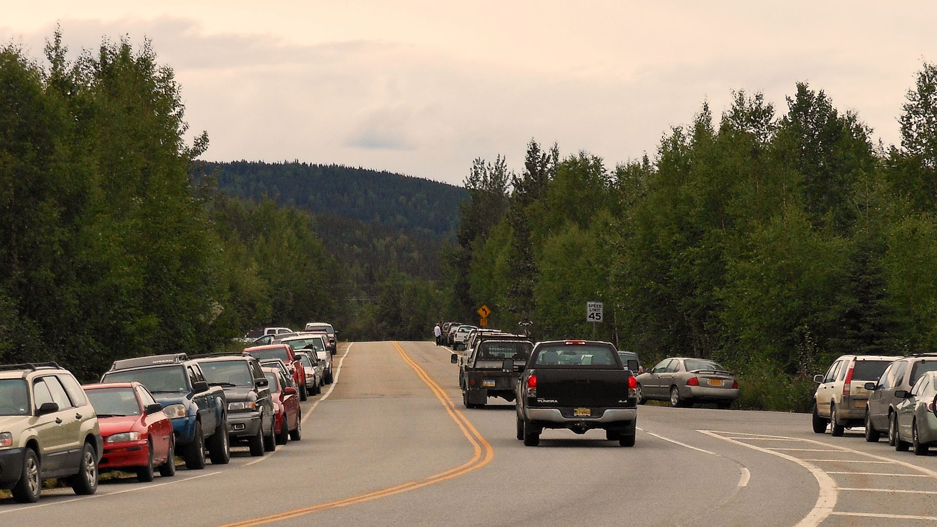 File:Old Nenana Highway, Ester, Alaska, showing cars lining the road during Angry, Young and Poor Festival.jpg