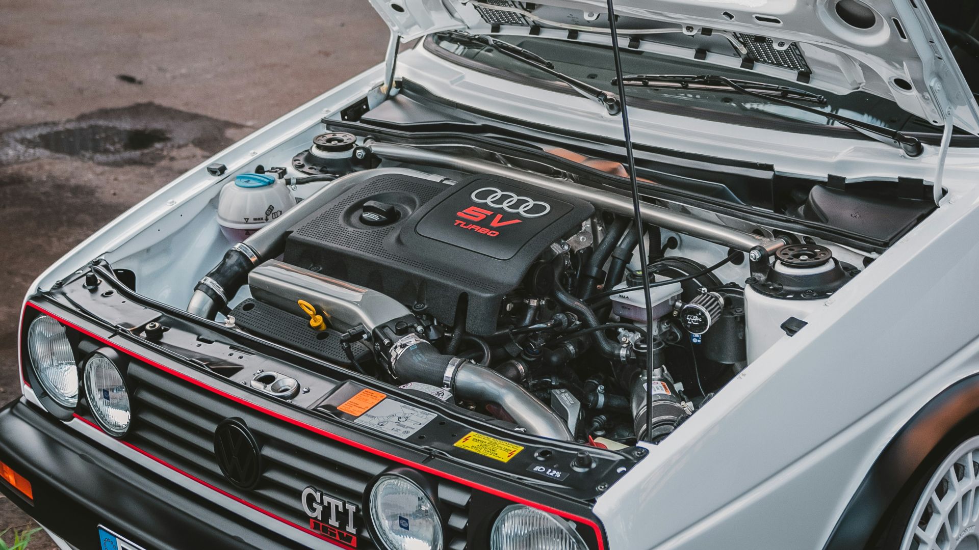 white vehicle engine bay