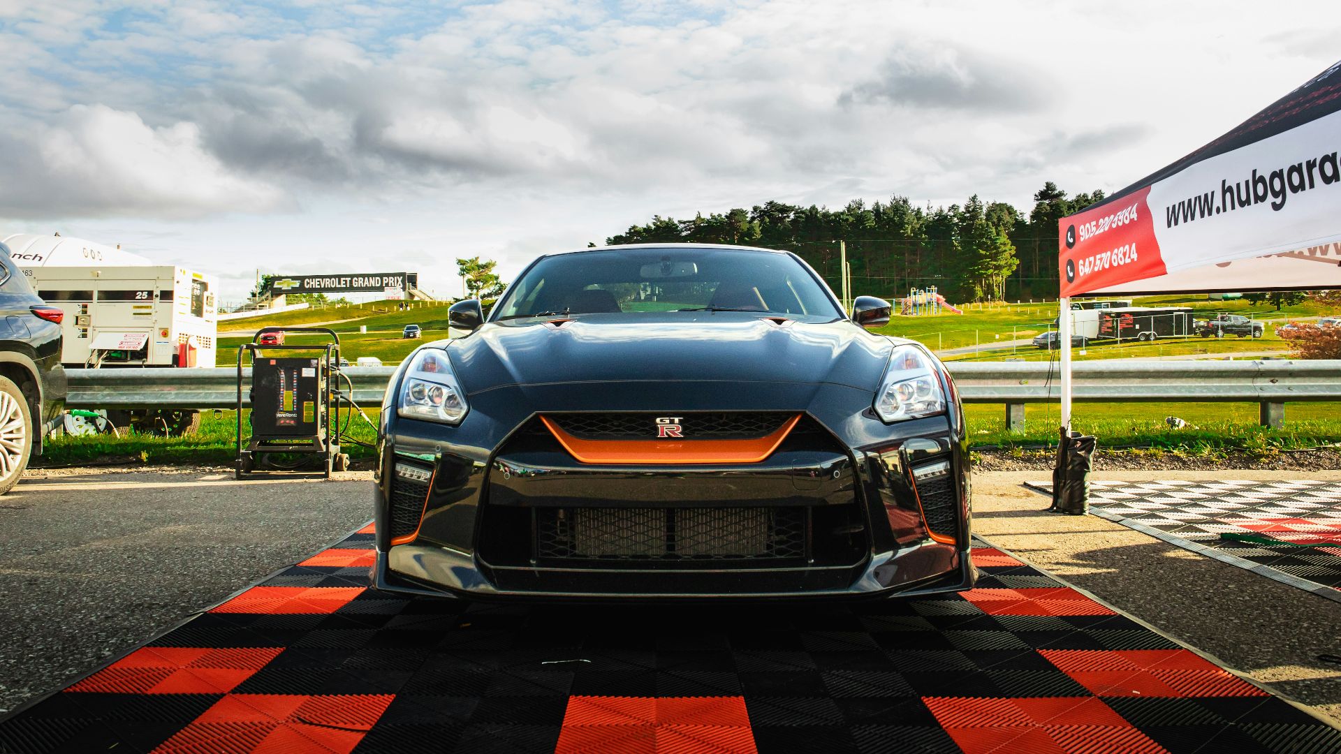 A black sports car on a race track