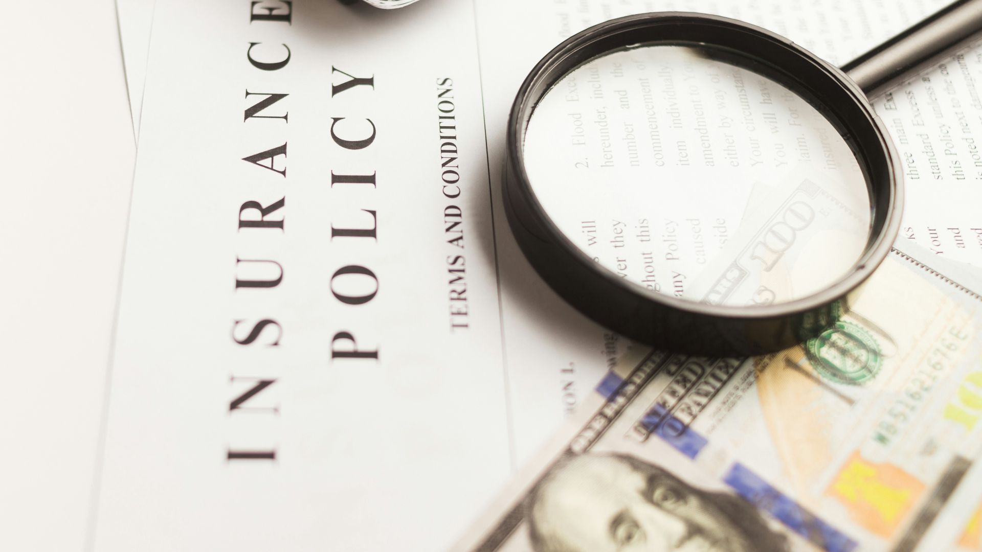 a magnifying glass sitting on top of a piece of paper