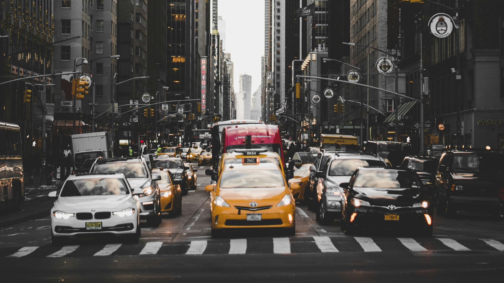 cars in between buildings