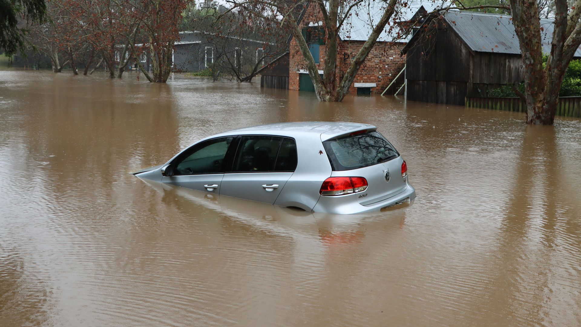 a car driving through a flooded street