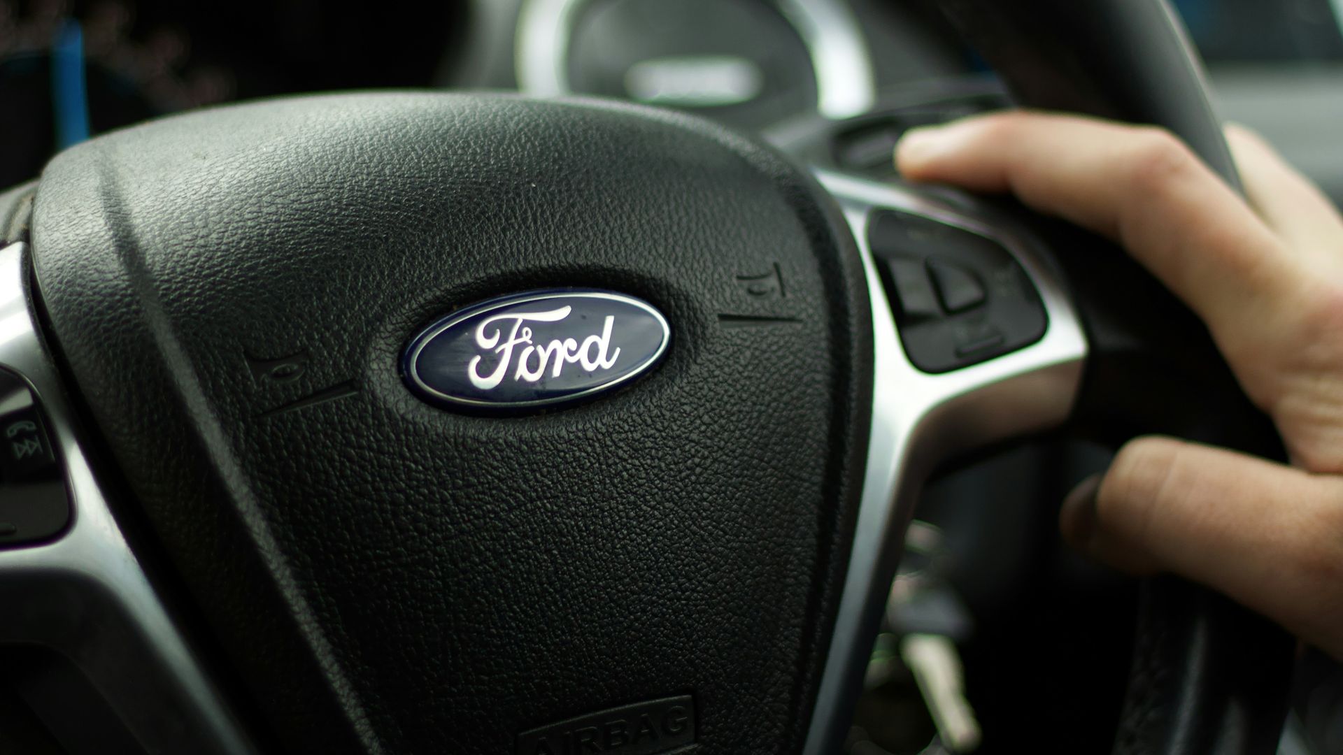 black nissan car steering wheel