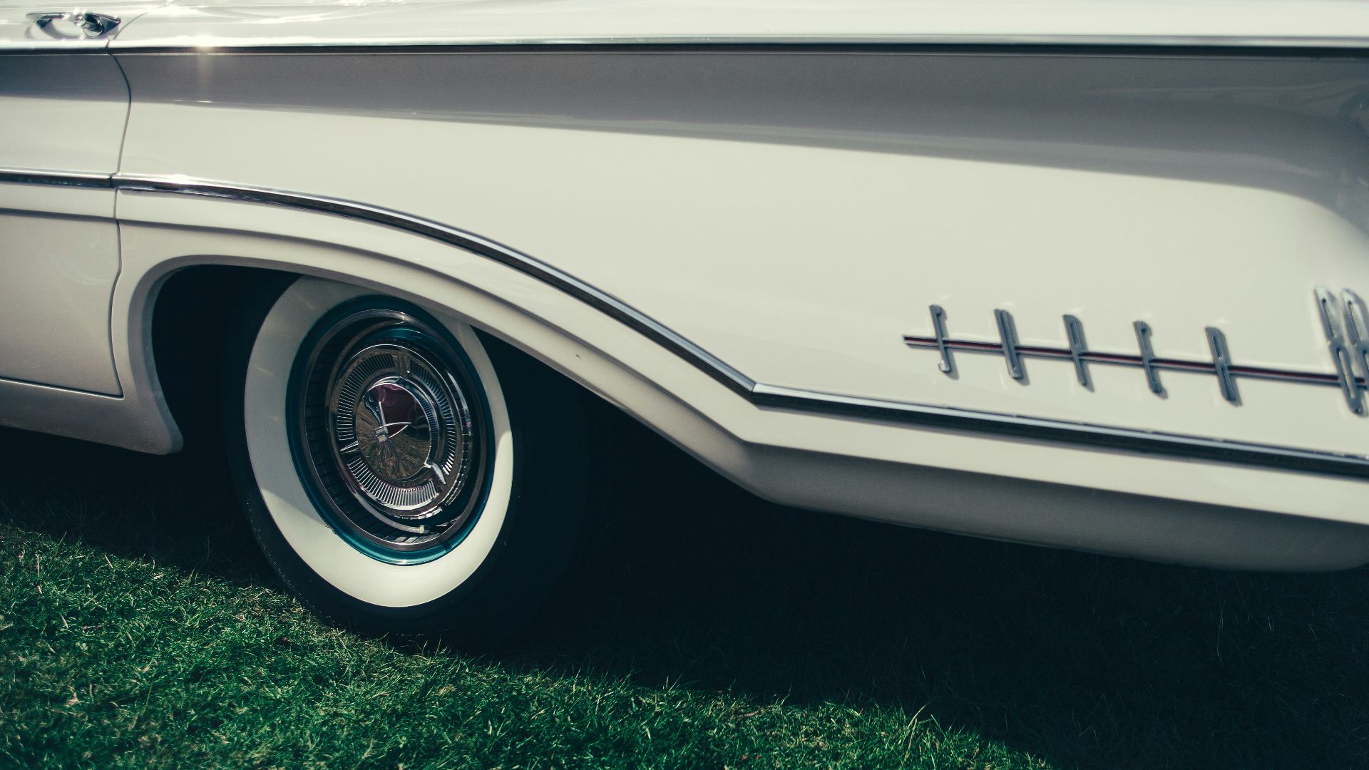 close-up photo of chrome wheel with tire
