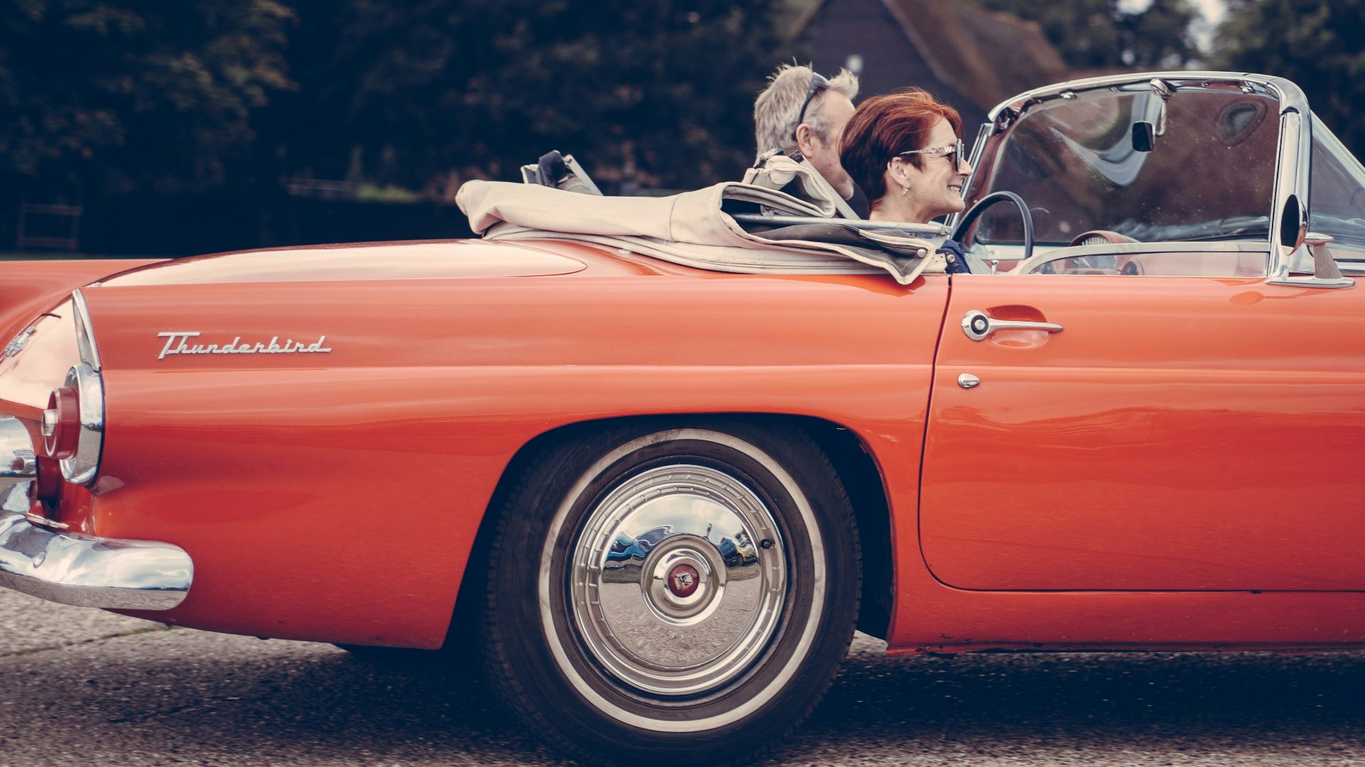 two person riding vintage coupe