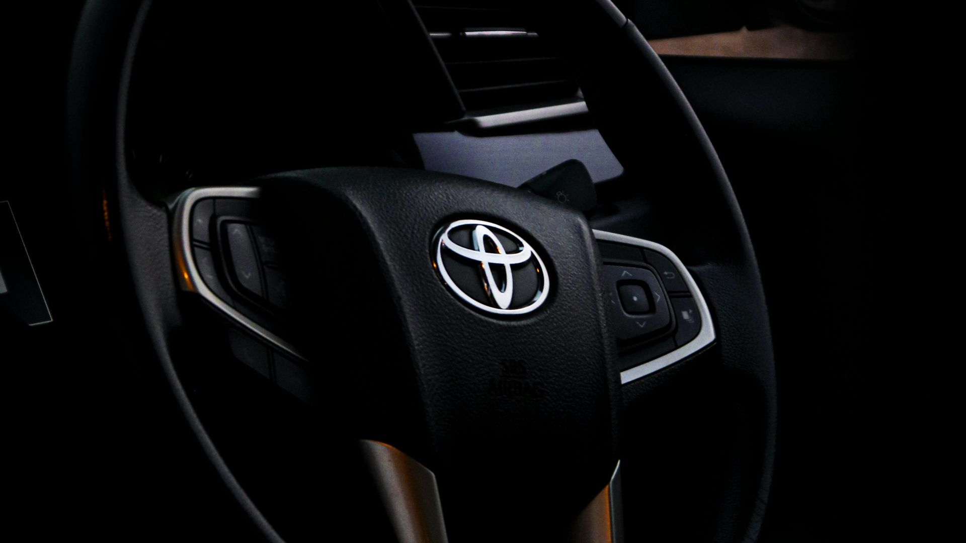 black and silver mercedes benz steering wheel