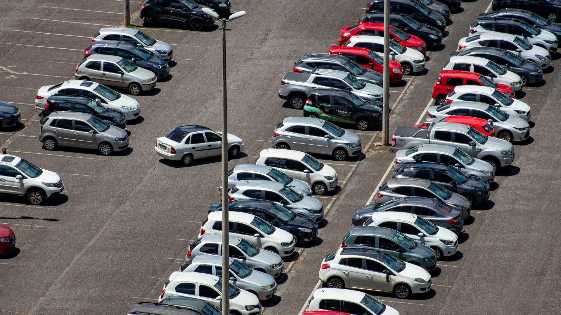 cars parked on parking lot during daytime