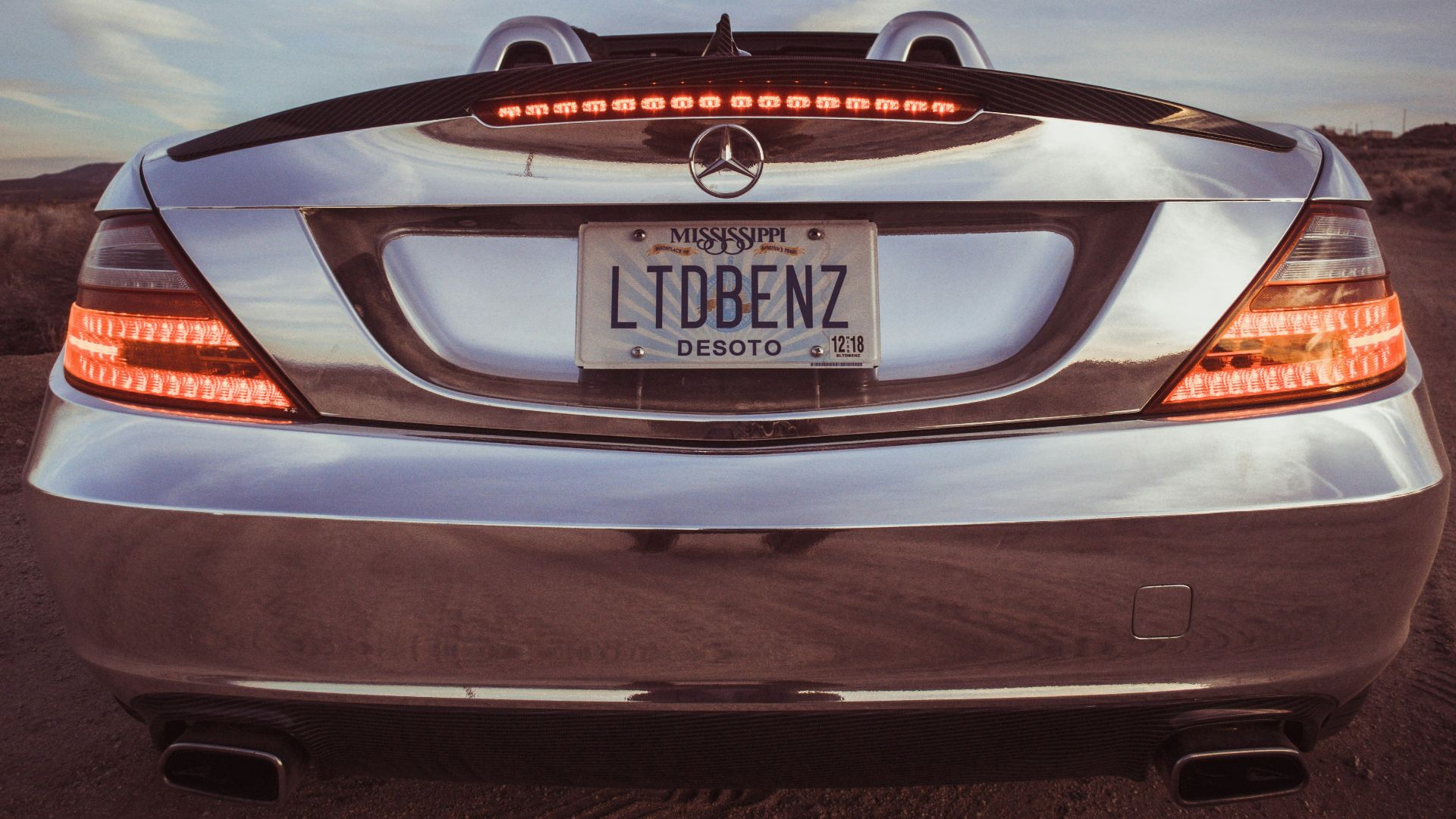 silver Mercedes-Benz car with LTDBENZ license plate