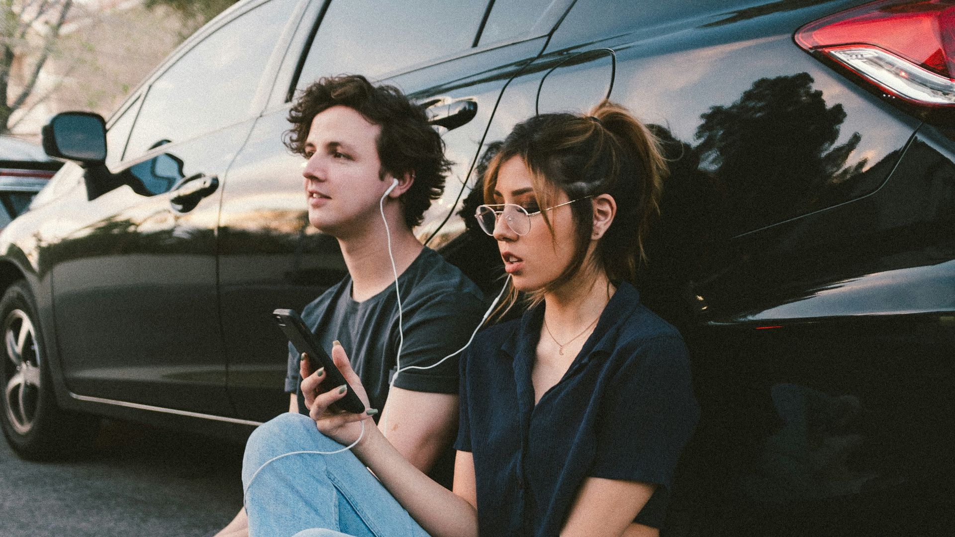 man and woman beside vehicle