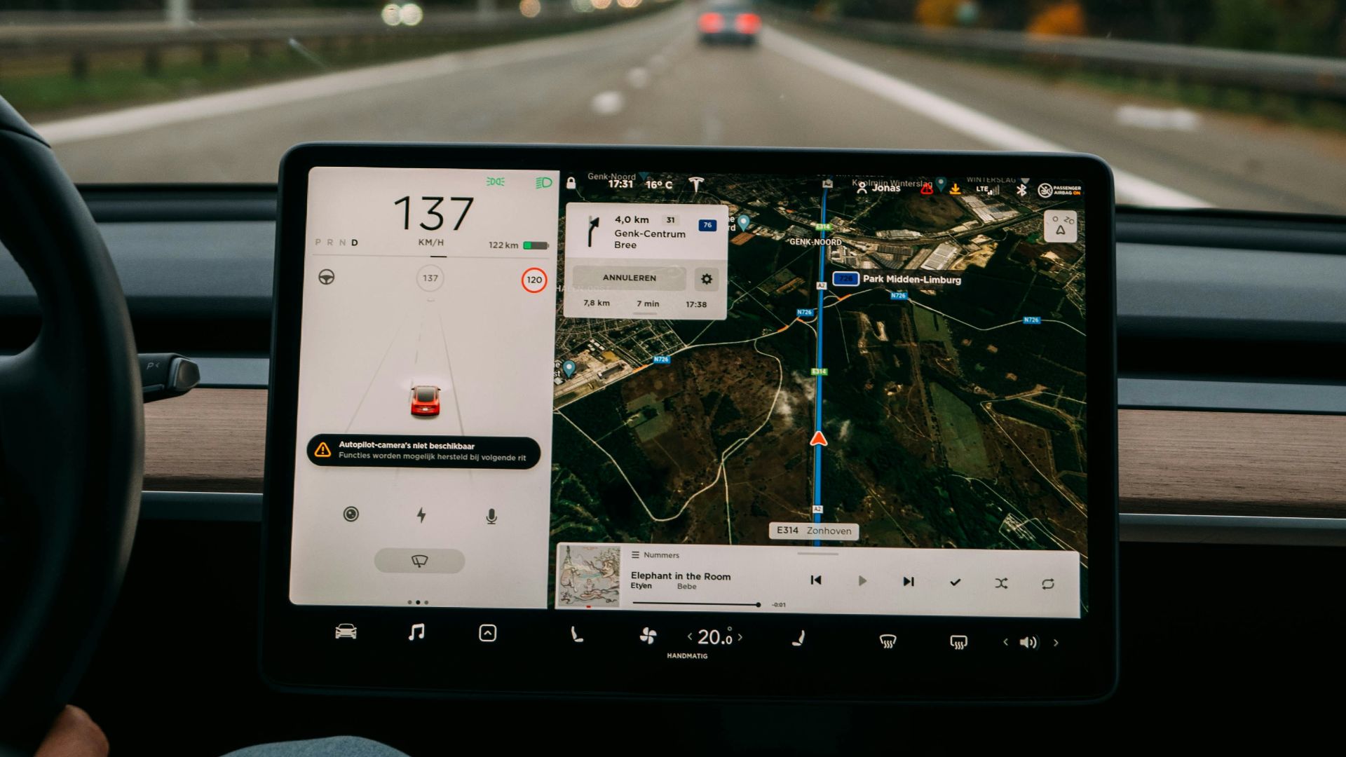 person holding white ipad inside car