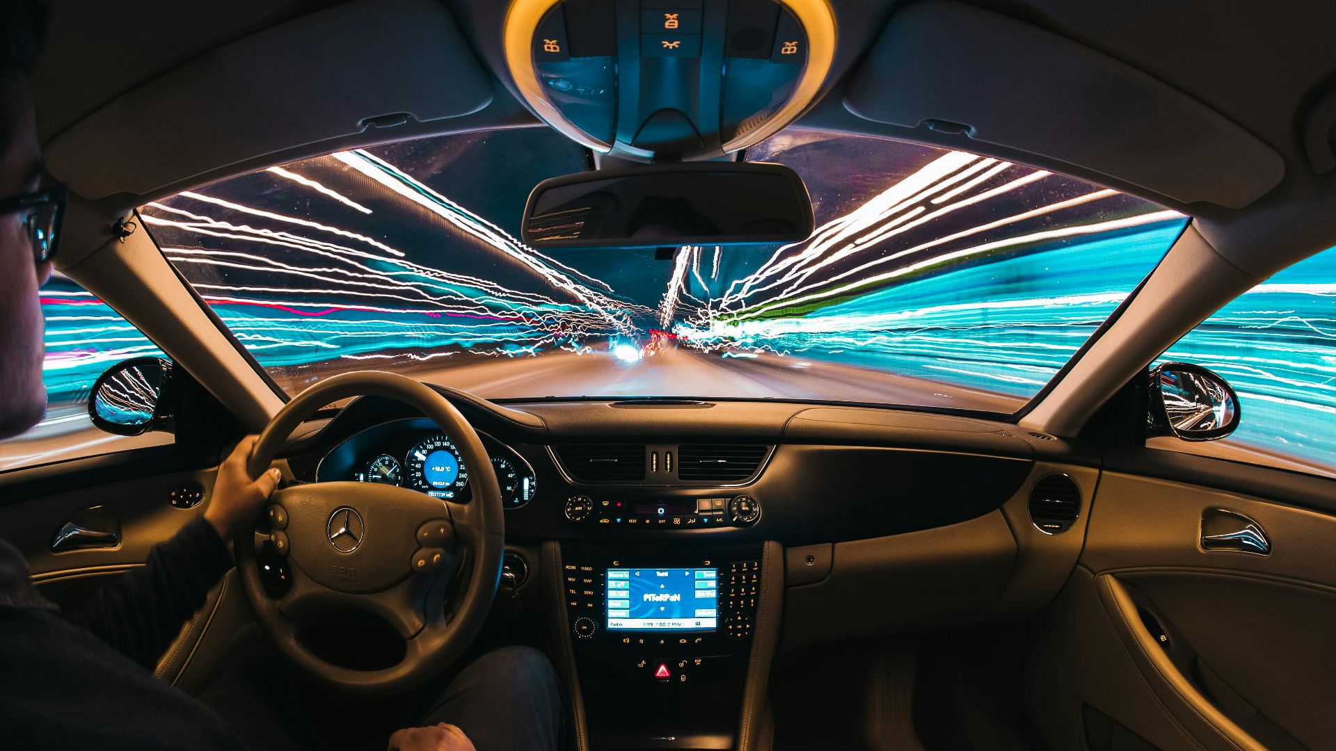 time lapse photography of man riding car