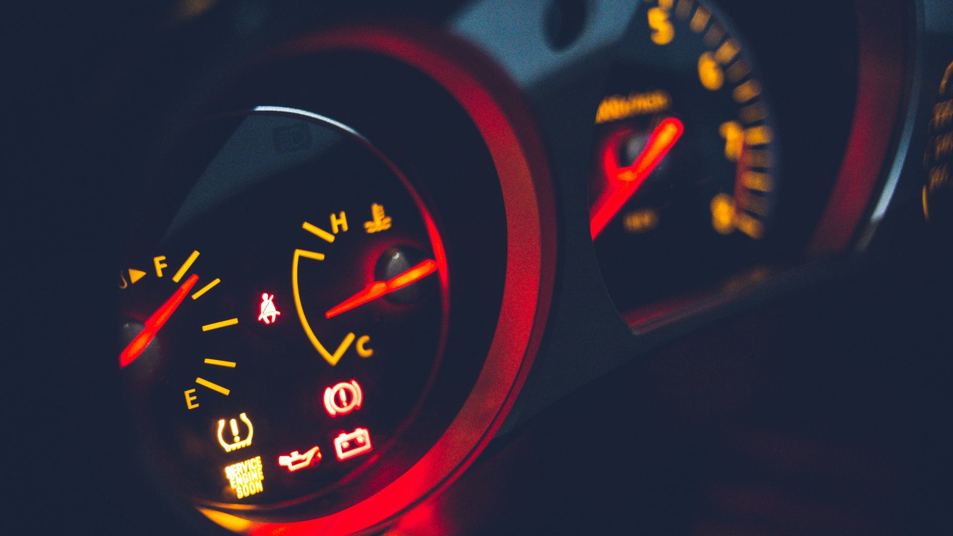 black and red analog speedometer