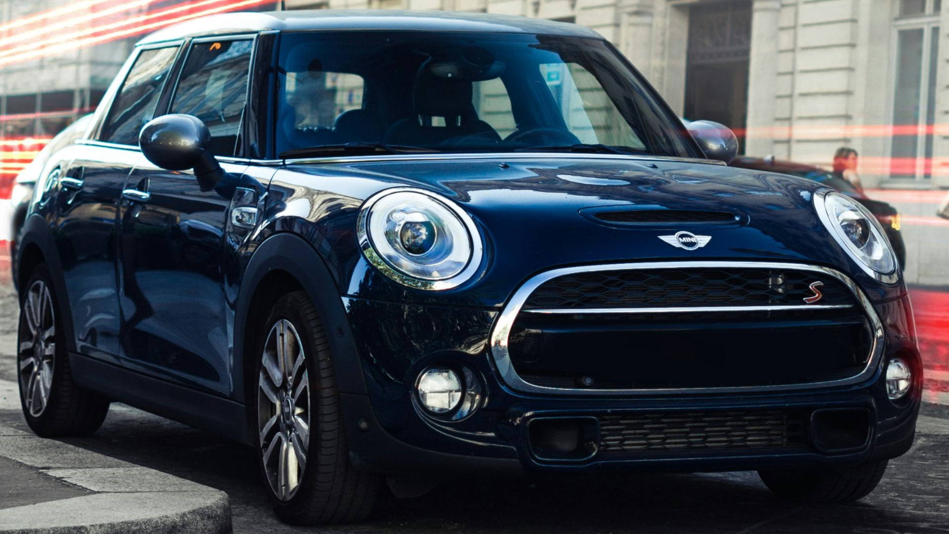 black mercedes benz c class parked on street during daytime