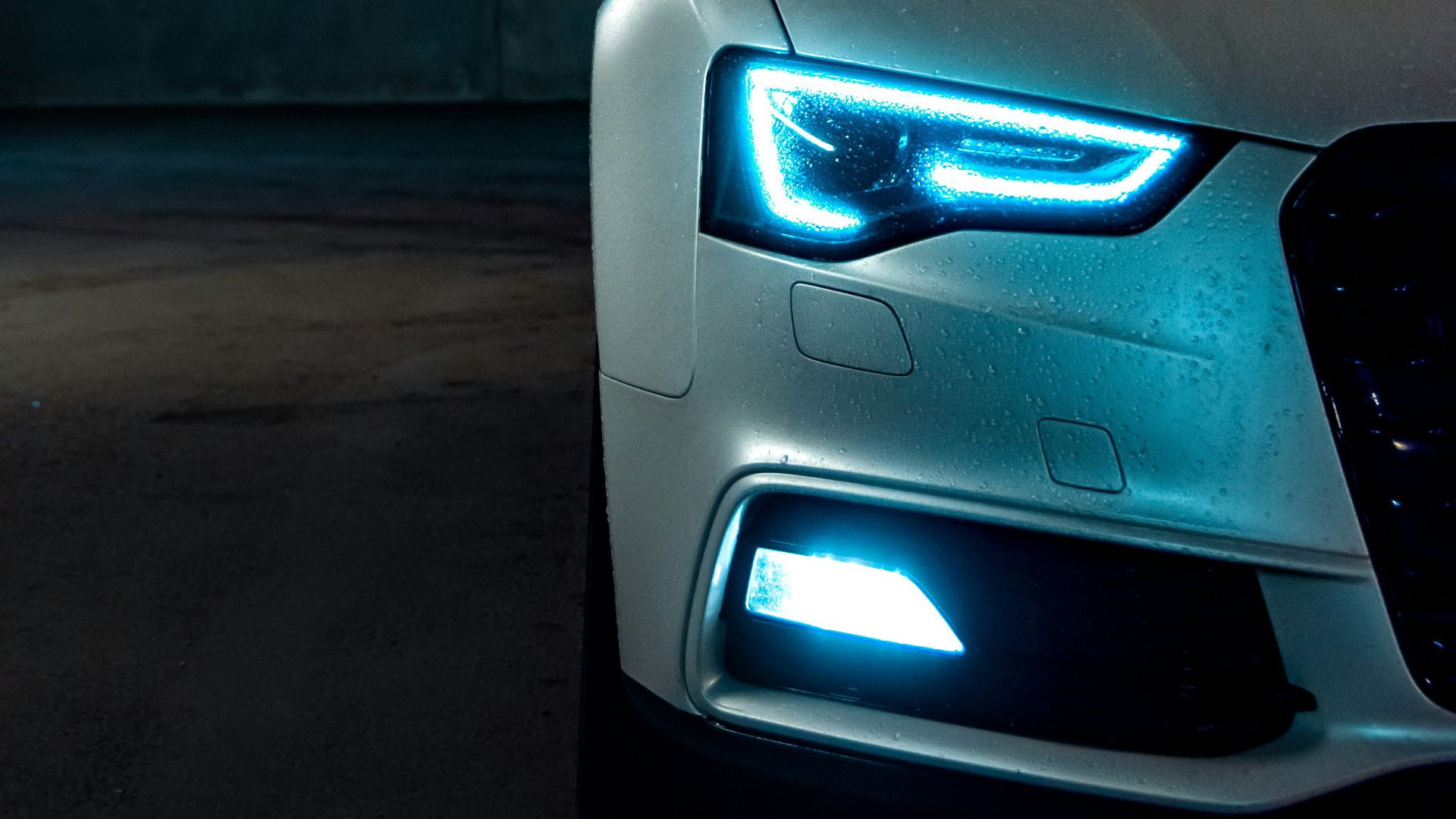 white vehicle with blue neon headlight bulb