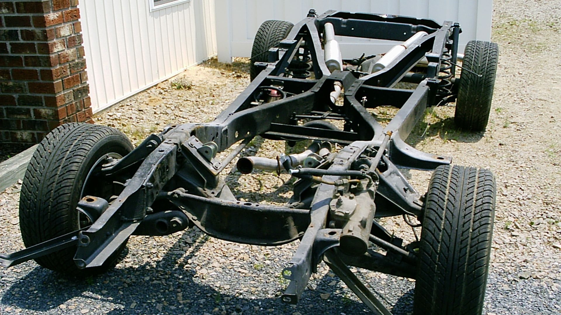 File:Chassis with suspension and exhaust system.jpg