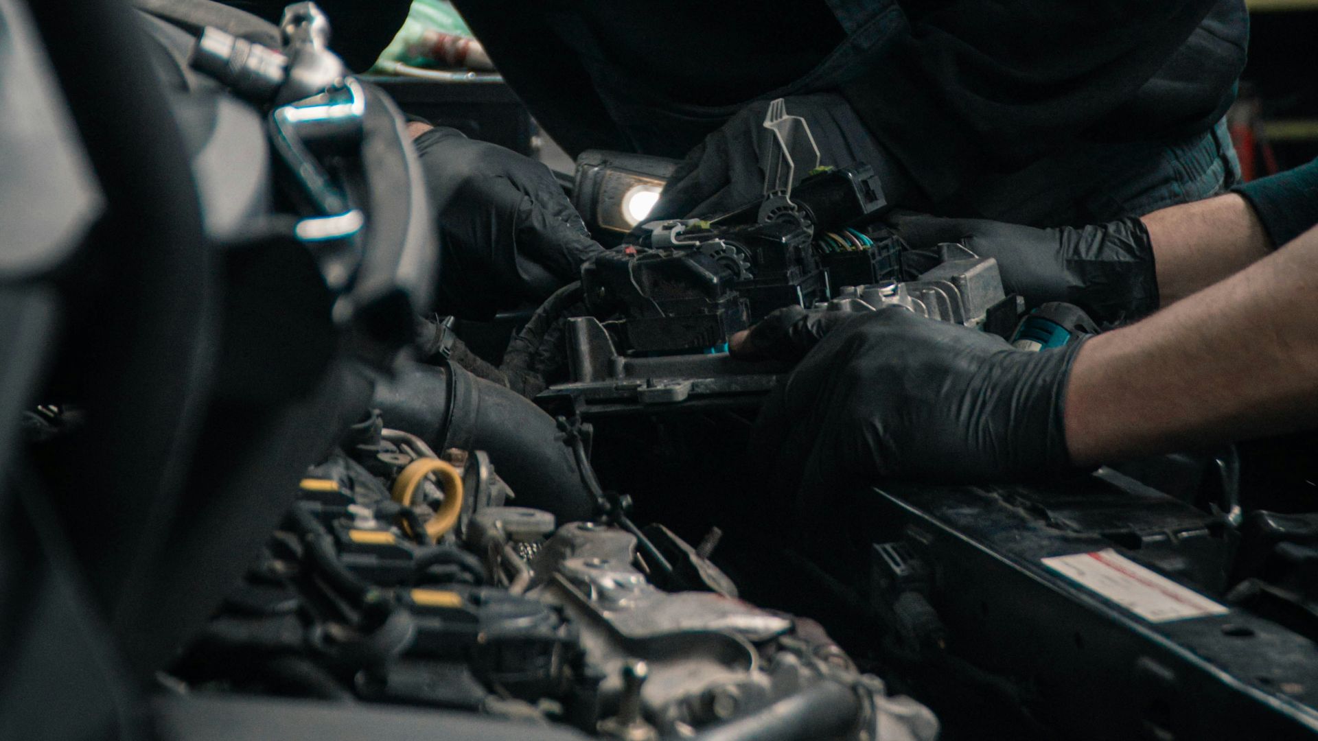 man in black jacket and blue denim jeans riding motorcycle
