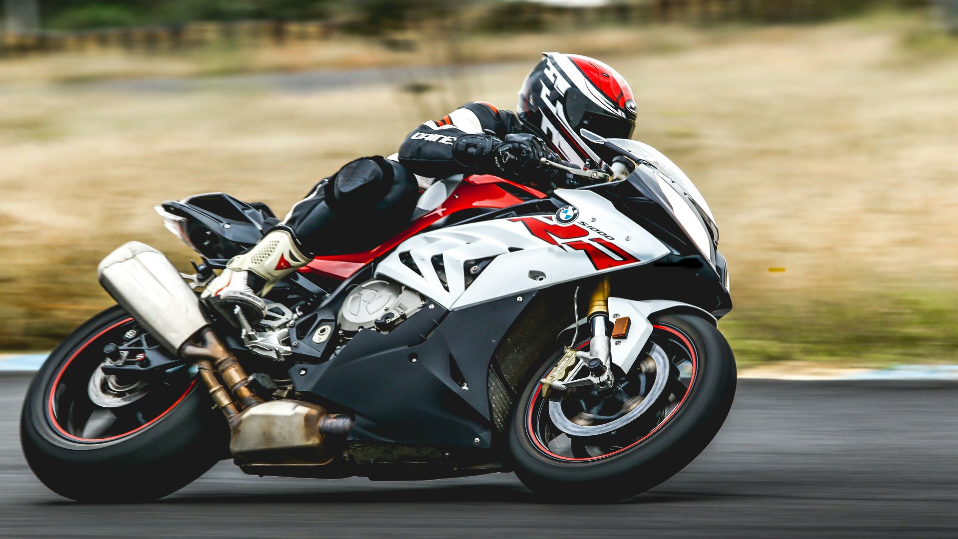 man riding sports bike