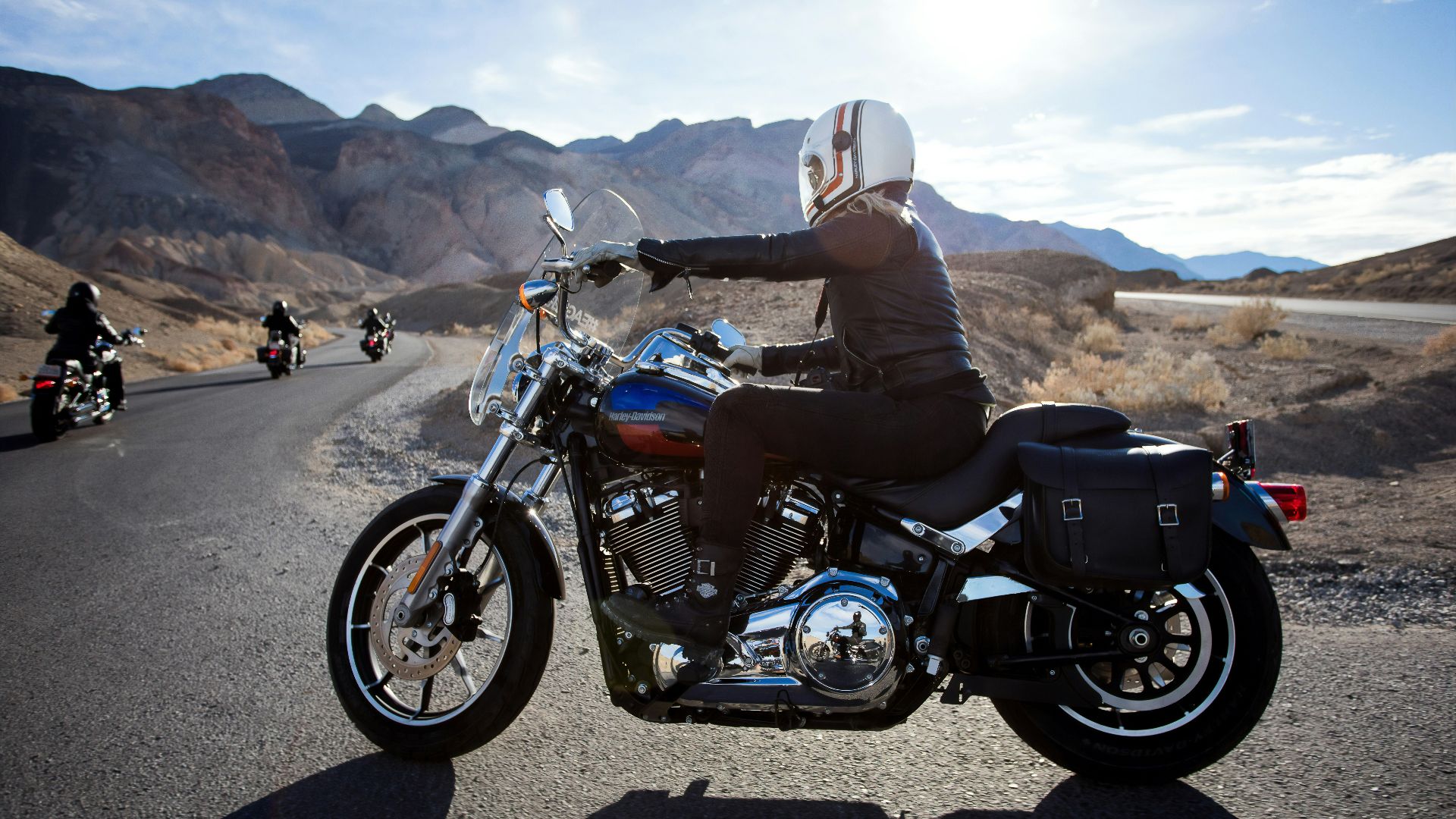 man riding touring motorcycle during daytime