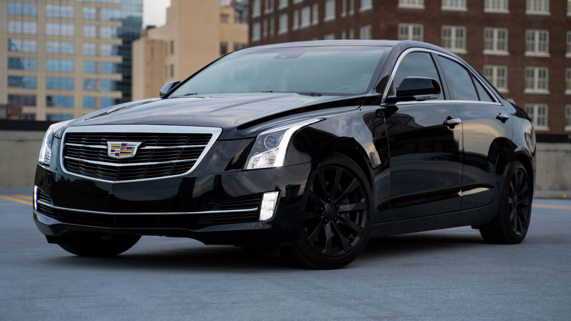 black mercedes benz c class parked on road during daytime
