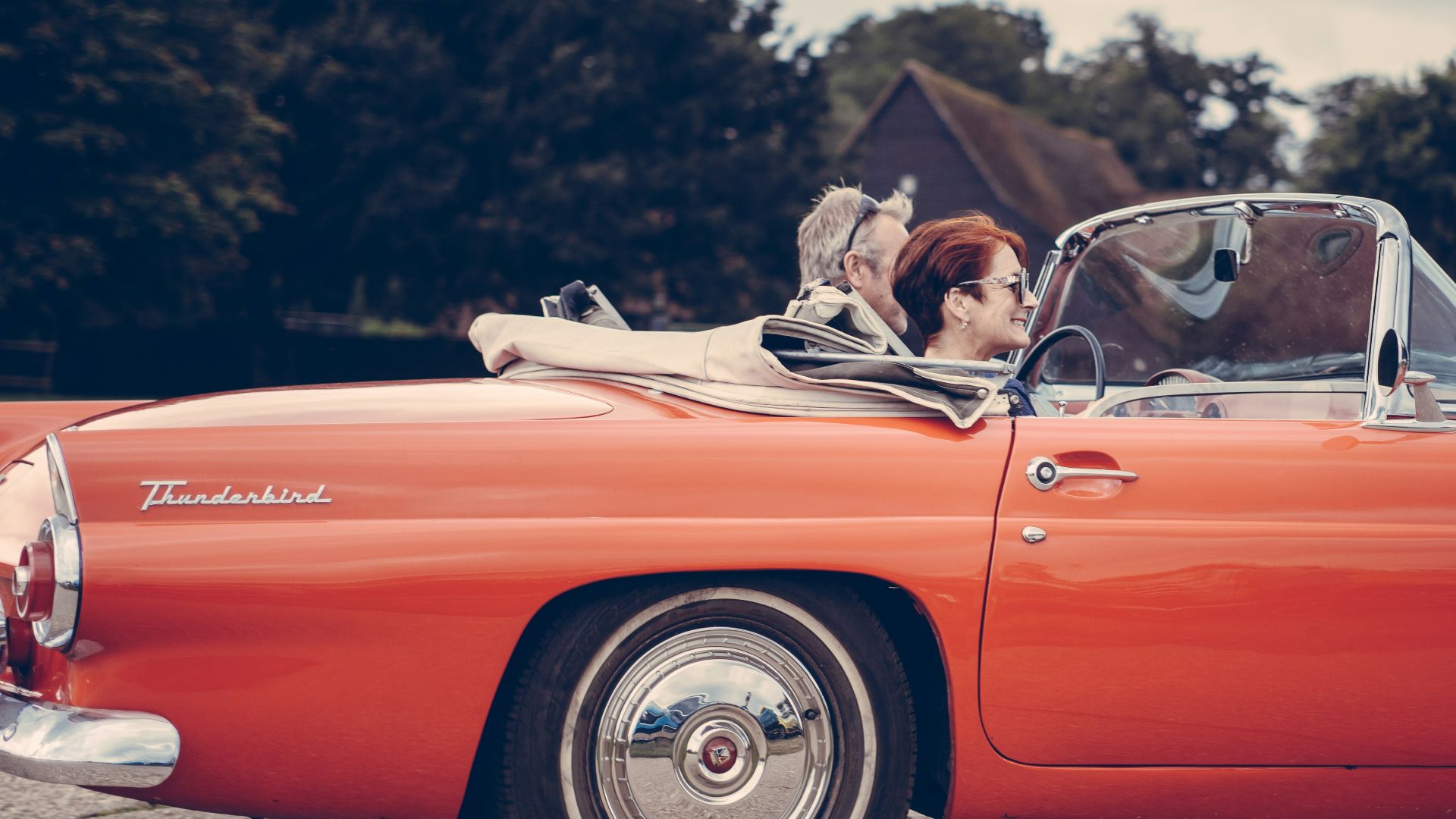 two person riding vintage coupe