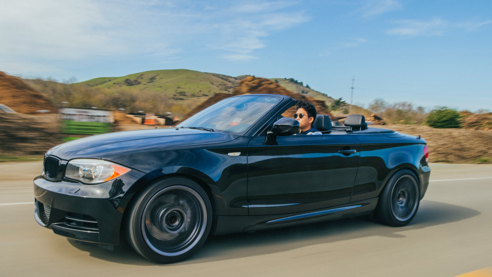 blue convertible coupe on road during daytime