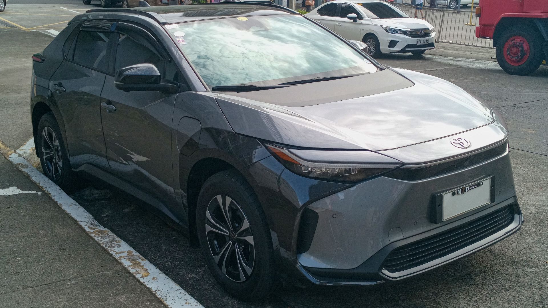 File:2023 Toyota bZ4X FWD in Heavy Metal, front right.jpg