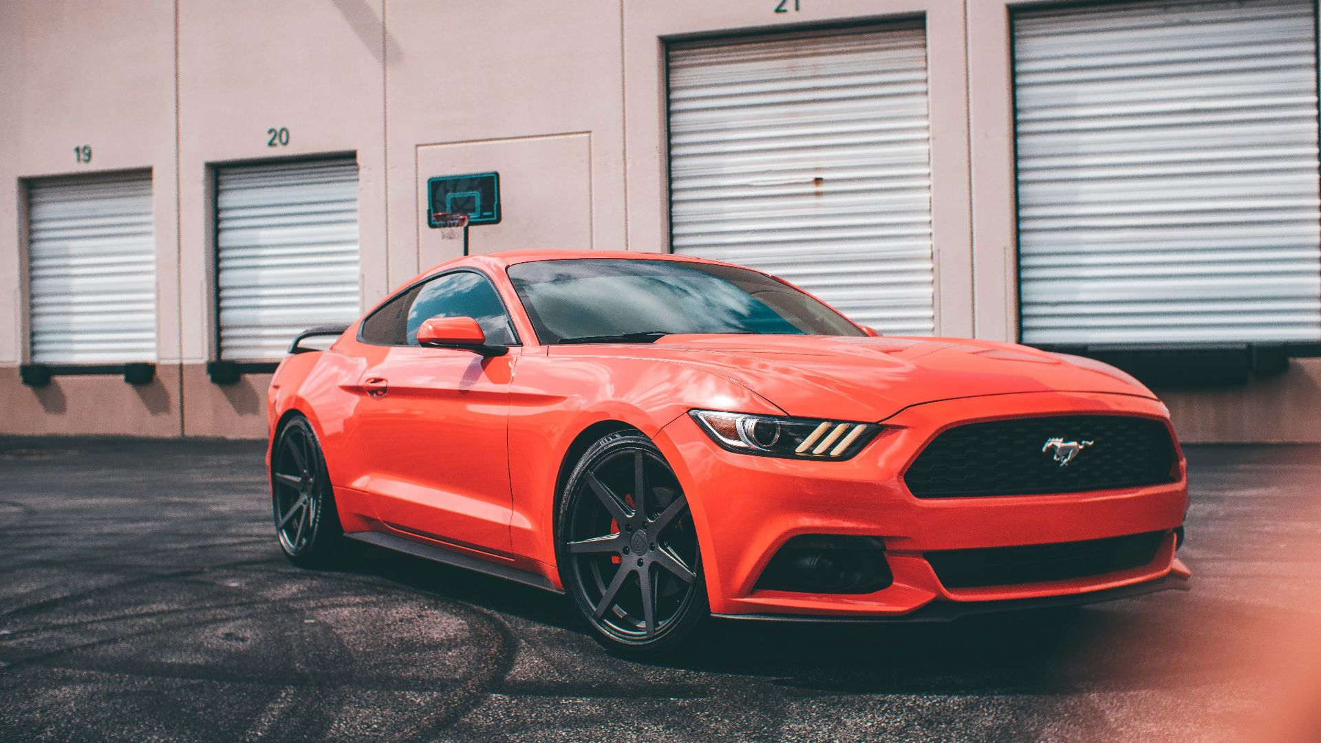 red bmw m 3 coupe parked in garage