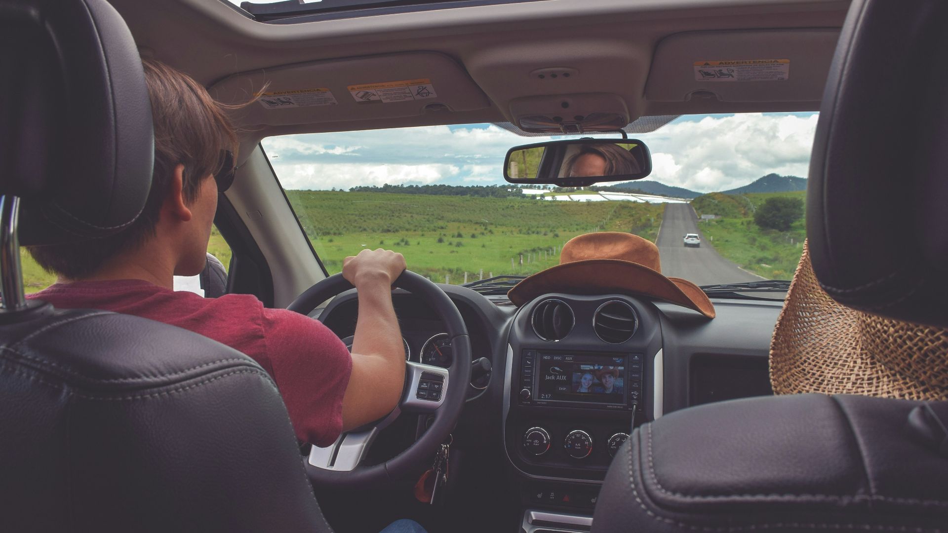 man driving straight on pathway during day time