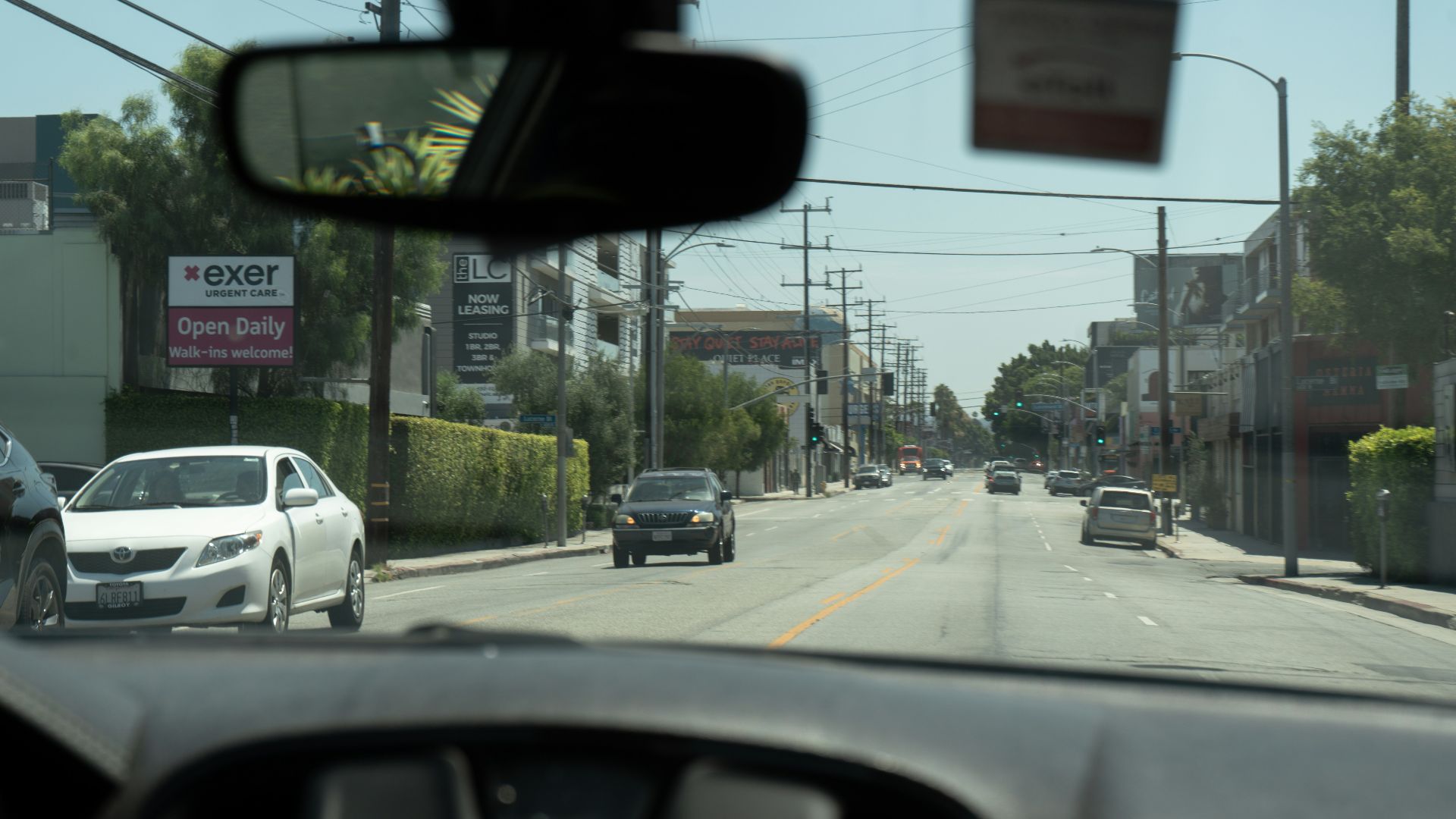 A view of a street from inside a car