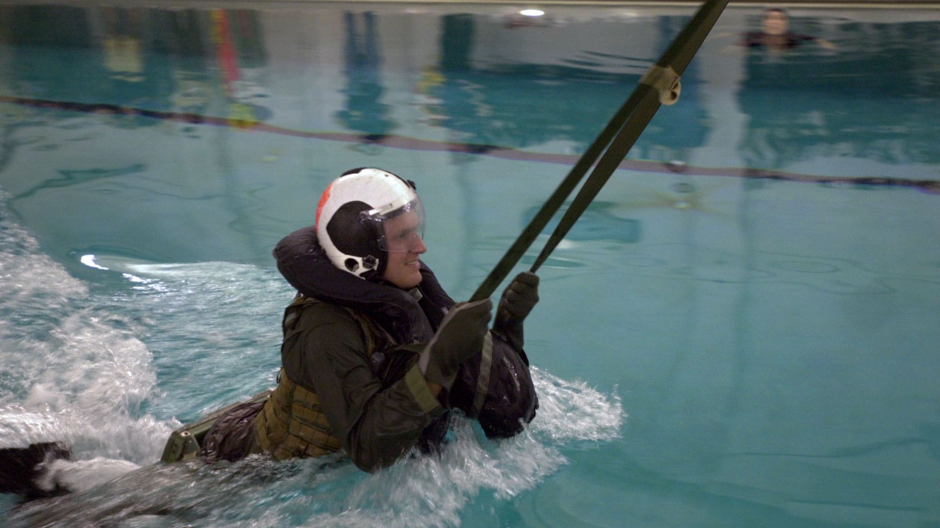 File:US Navy 060201-N-7750K-002 Driver of the Navy sponsored NASCAR Busch series number 88 car, Mark McFarland, completes the parachute drag during survival training at the Aviation Survival Training Center onboard Naval Air Station.jpg