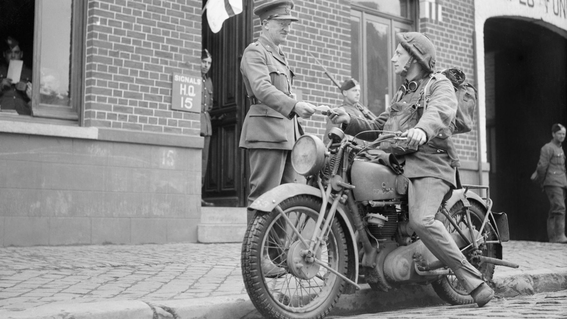 File:A motorcycle despatch rider delivers a message to the signals office of 1st Border Regiment at Orchies, France, 13 October 1939. O129.jpg