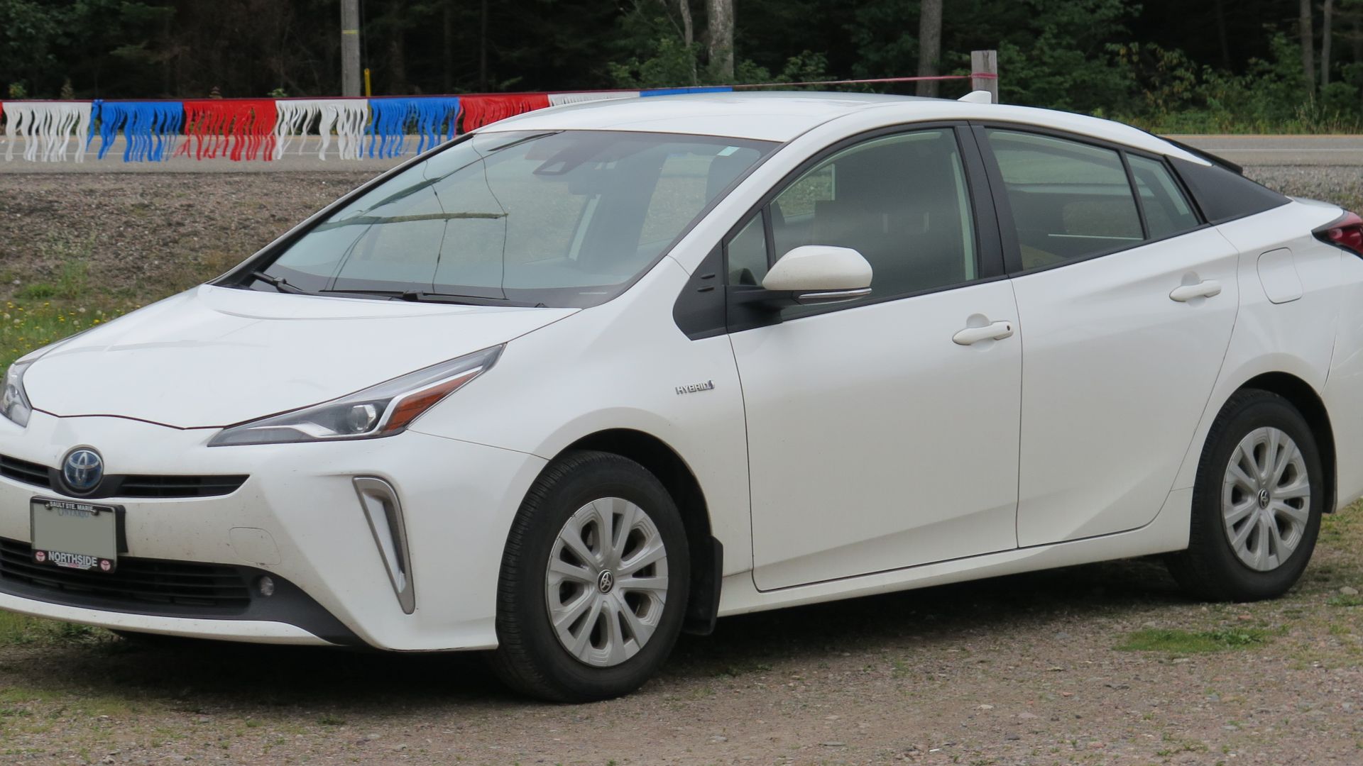 File:2019 Toyota Prius AWD-e in Super White, Front Left, 08-21-2022.jpg
