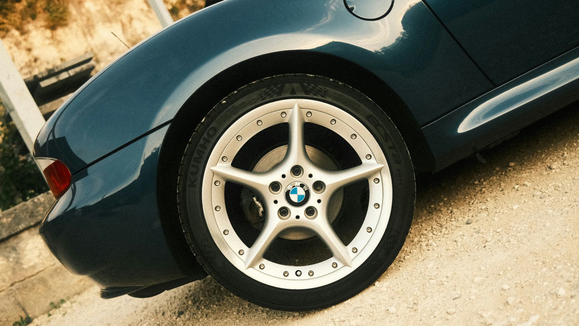a close up of a car tire on a road