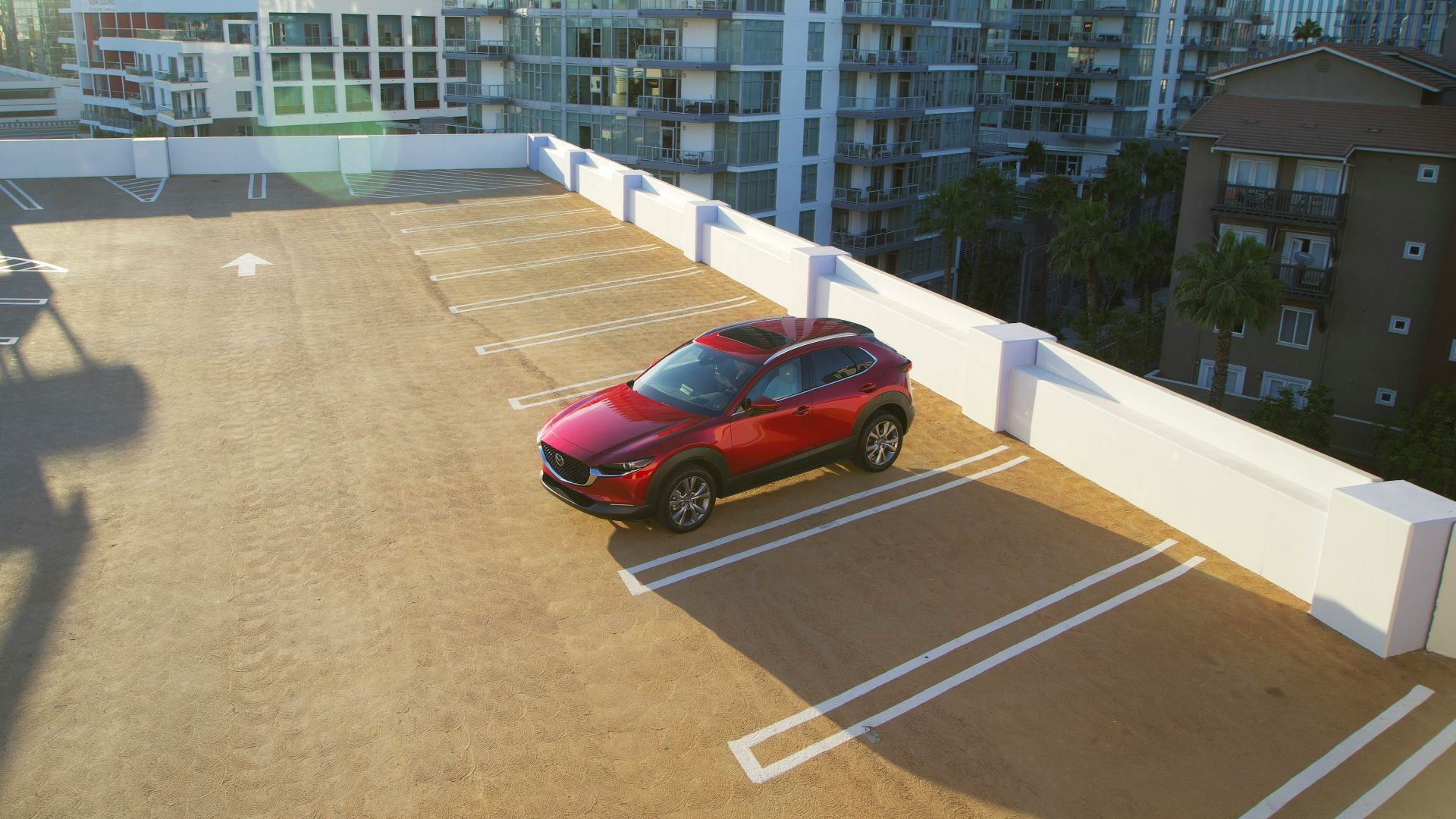 red coupe on road during daytime