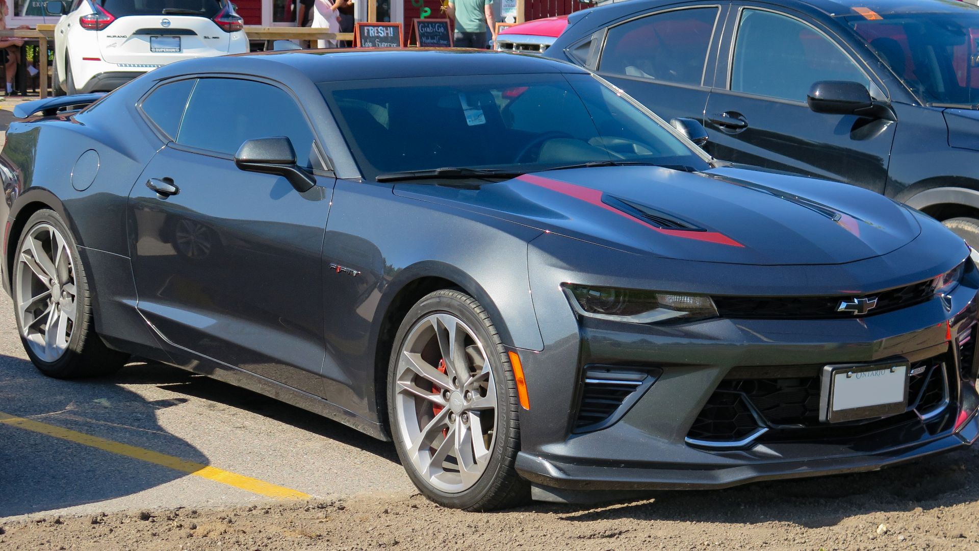 File:2017 Chevrolet Camaro 2SS 50th Anniversary Edition Coupe in Nightfall Grey Metallic, Front Right, 07-29-2023.jpg