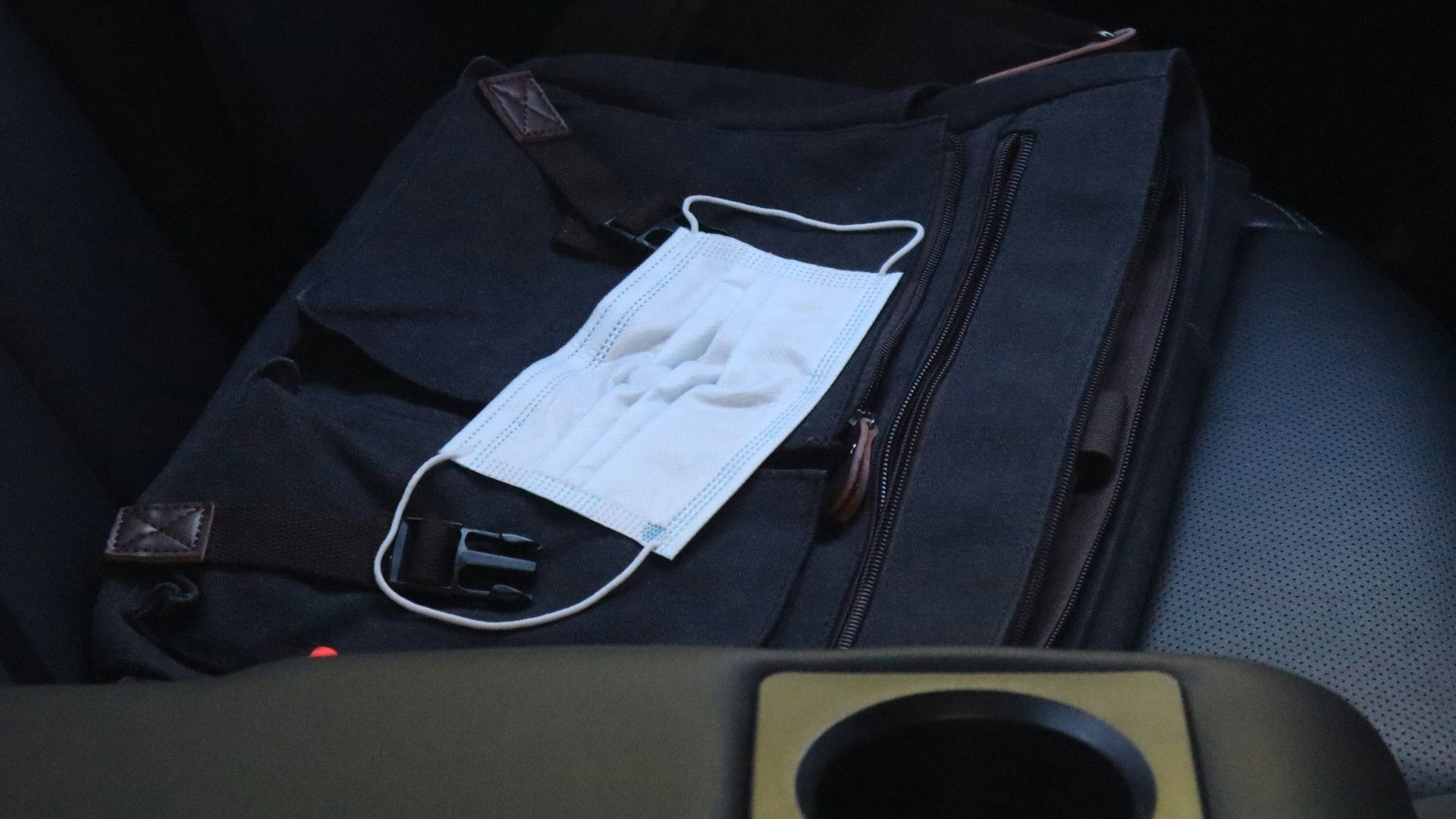 white paper on black bag