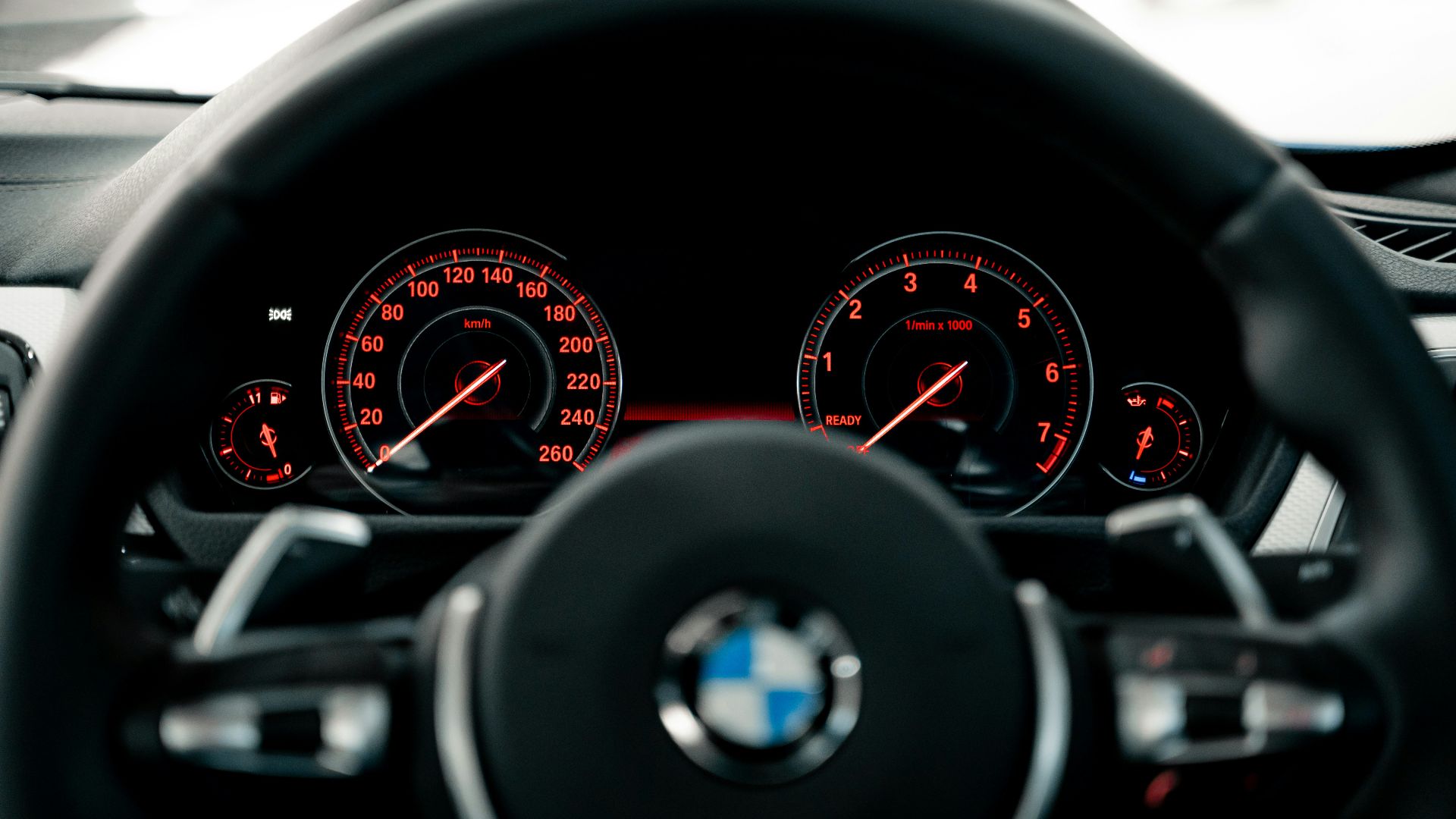 black BMW vehicle steering wheel
