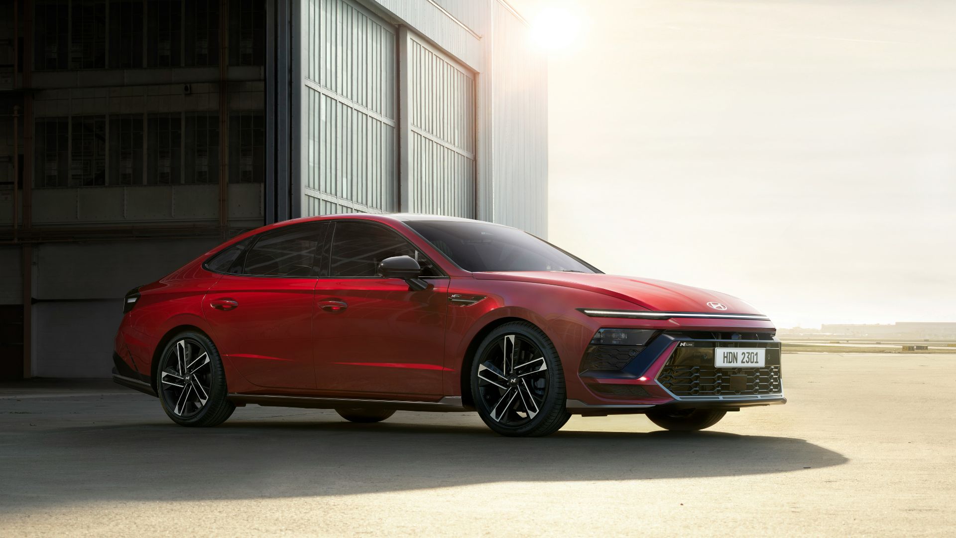 a red car parked in front of a building