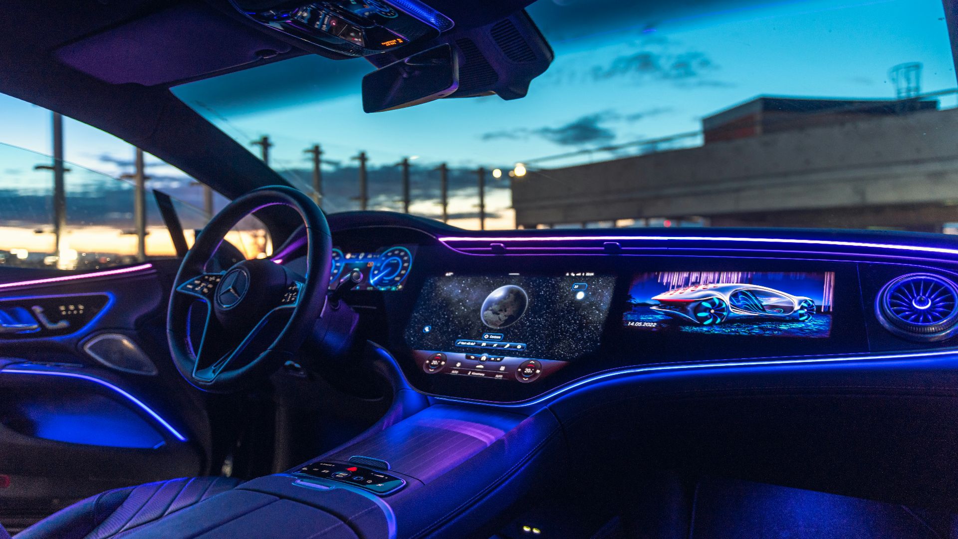 the interior of a car with blue lights