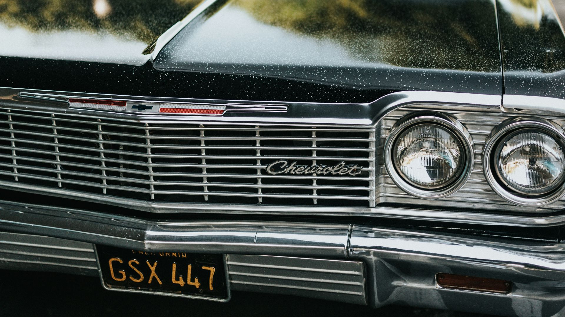 black mercedes benz car in front of white car