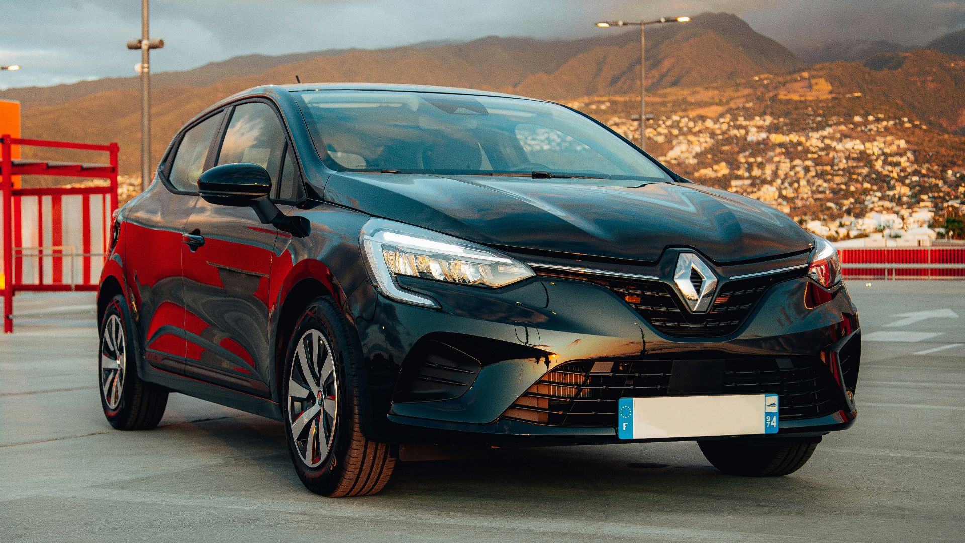 a black car parked on a road