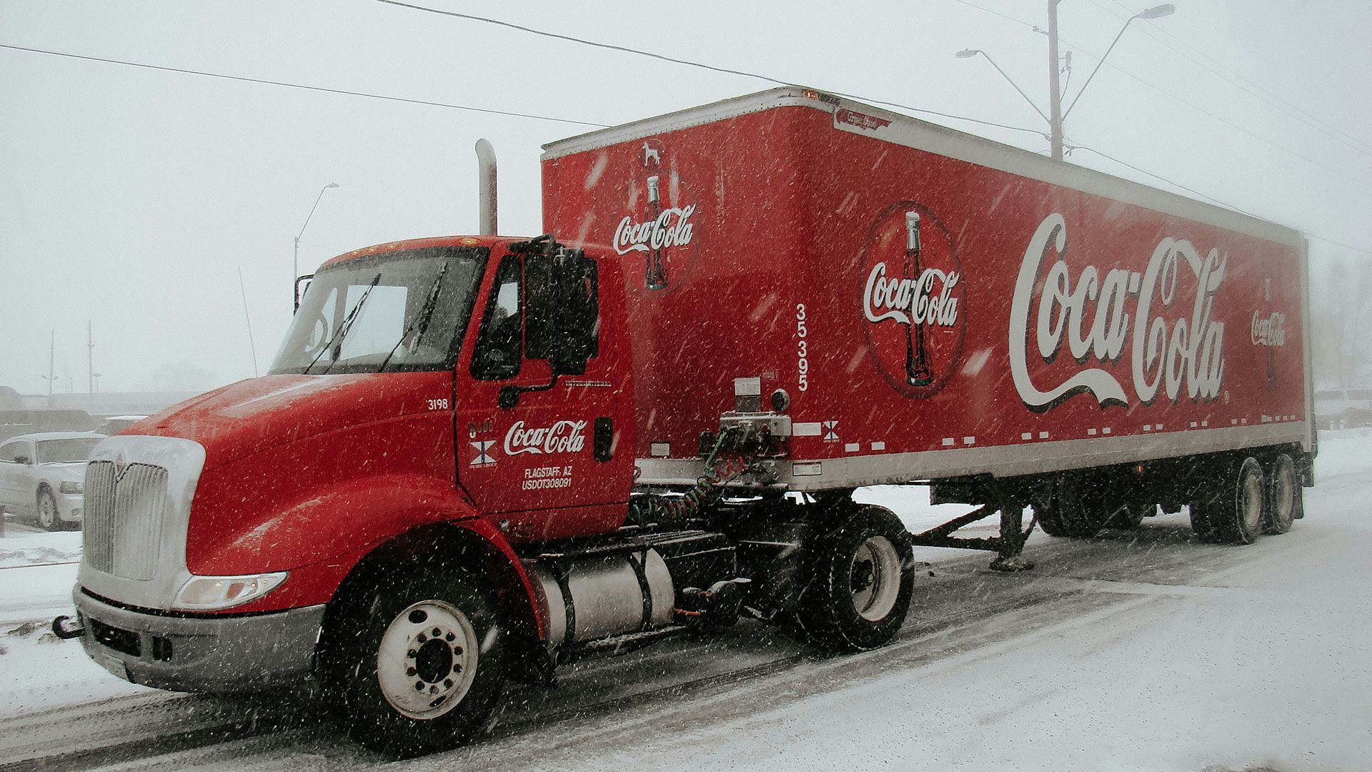 red Coca-Cola truck on road