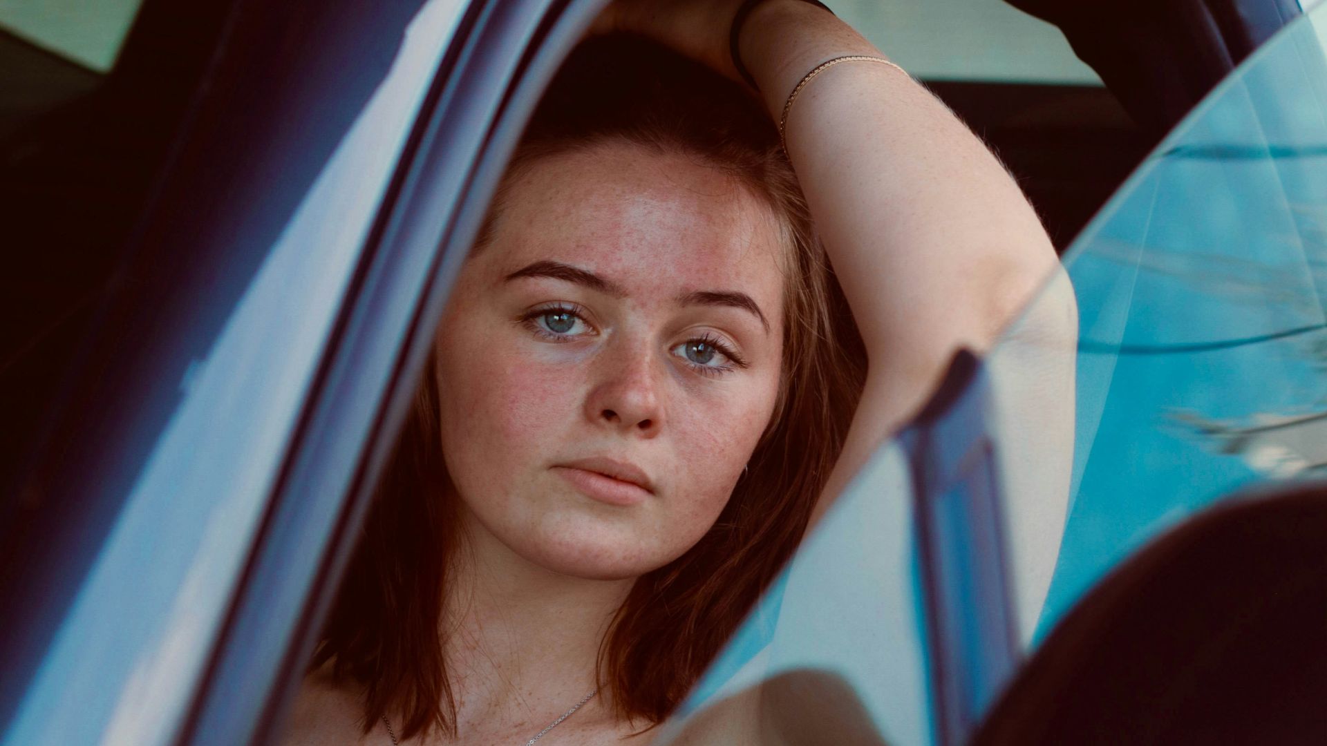 a woman sitting in a car
