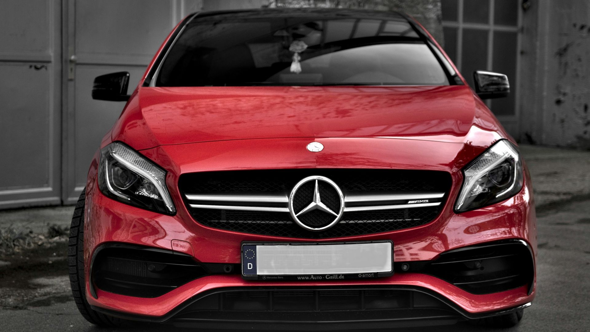 red Mercedes-Benz car on road