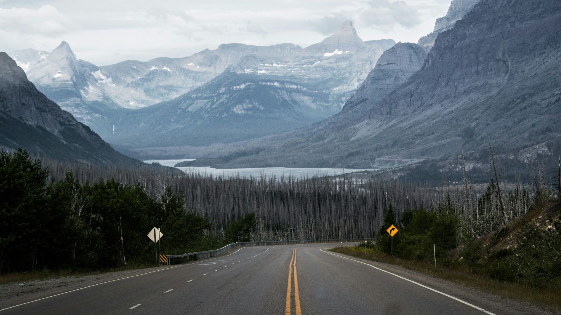 empty road front of mountains at daytime
