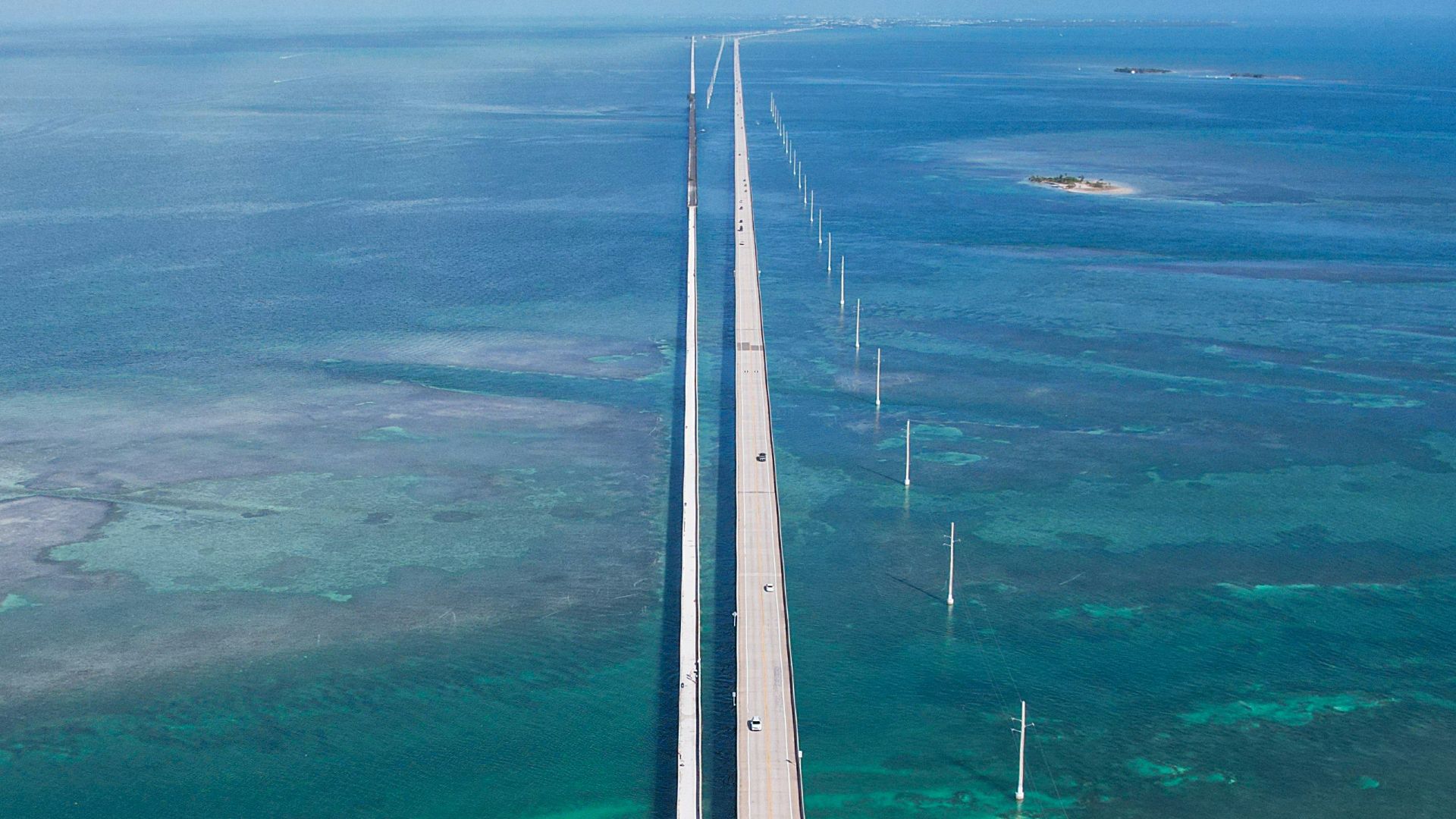An aerial view of a road and the ocean